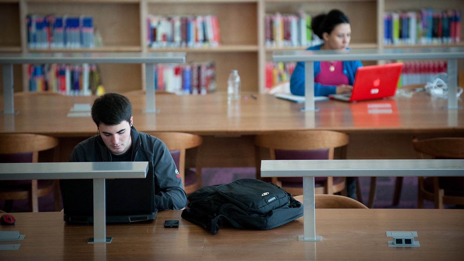 students studying at library table