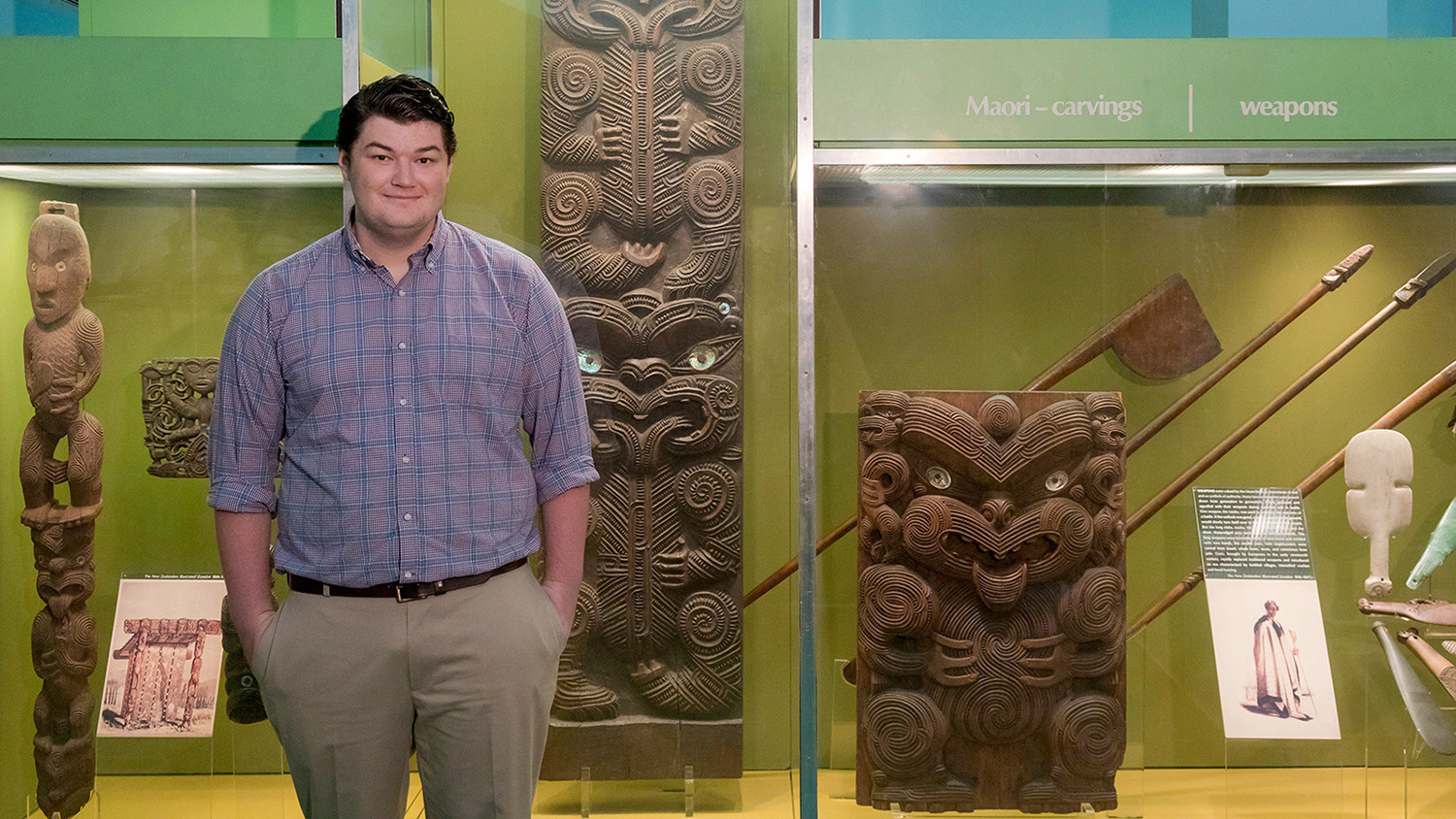 Student Colin Gravelle stands in the American Museum of Natural History
